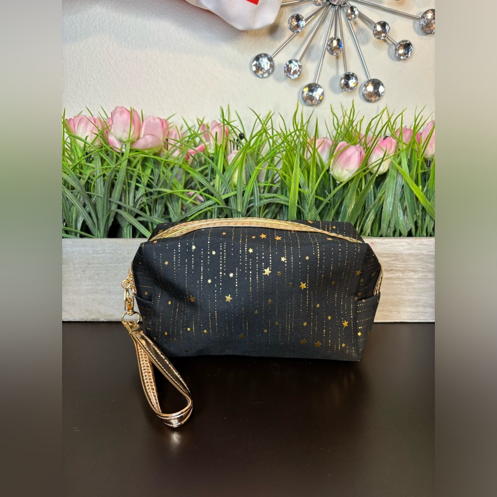 Pink and gold Star Print cosmetic bags with adjustable wristlet